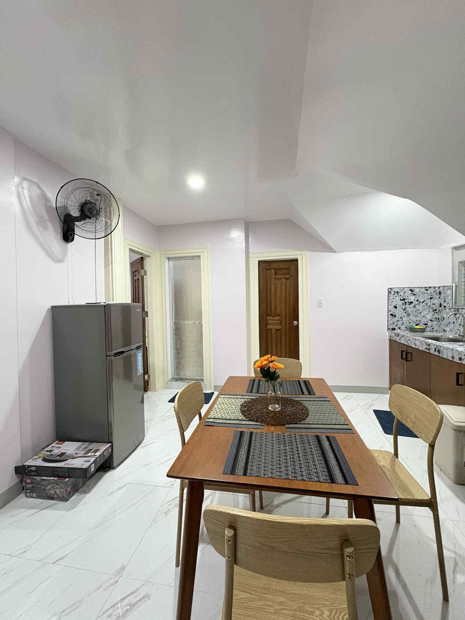 Cozy dining and living area at J&J Apartelle